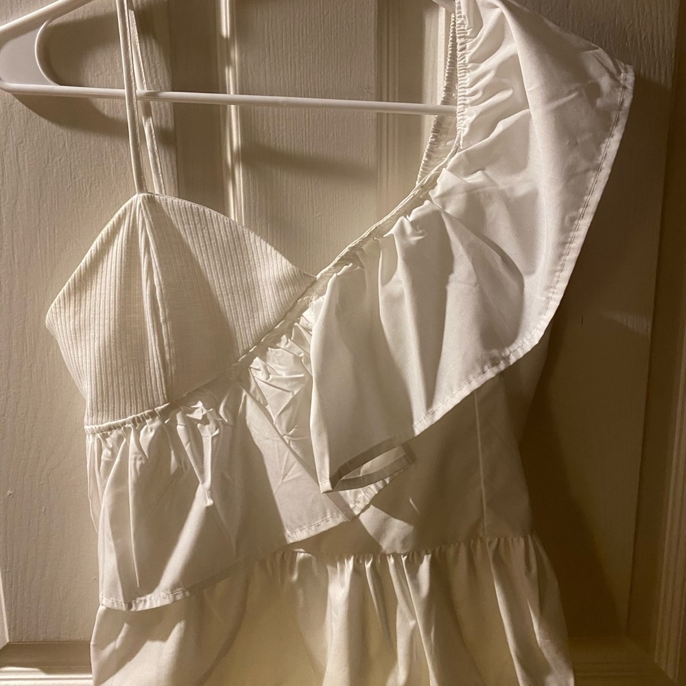 One should white ruffle top